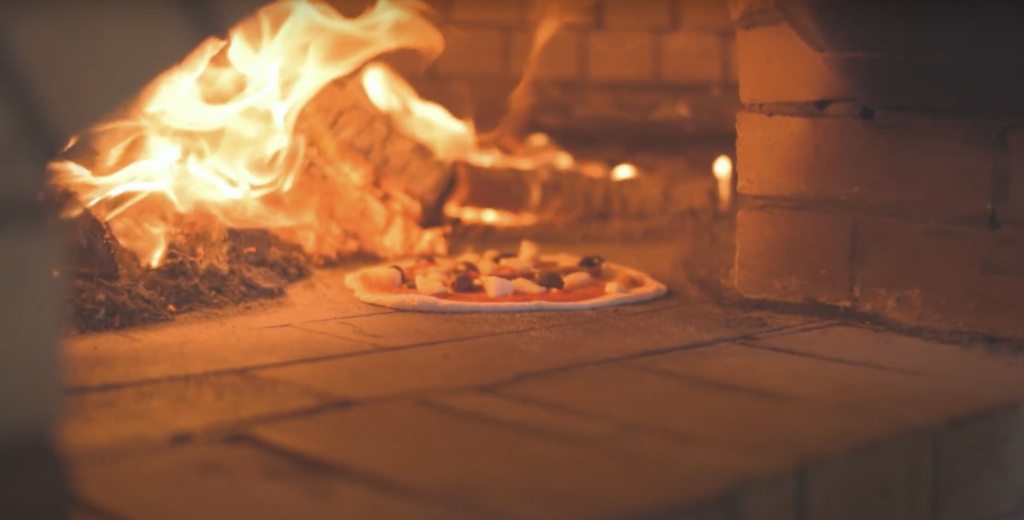 Authentic wood-oven Margherita pizza at Cafe Brunelli Adelaide